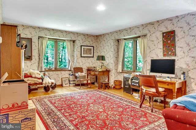 a living room with furniture and a large window
