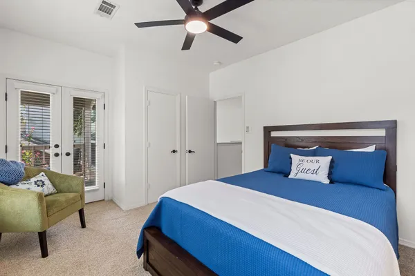 a bedroom with a bed and furniture