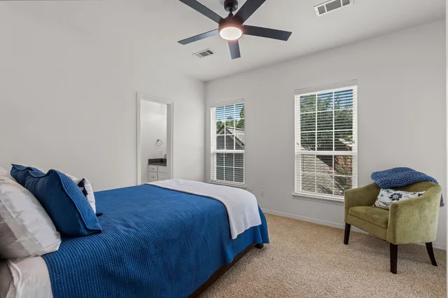 a bedroom with a bed and a couch