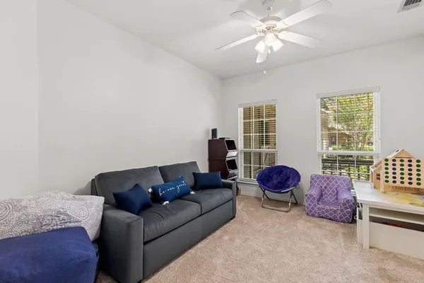 a living room with furniture and a window