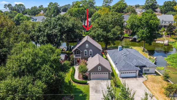 an aerial view of houses with yard
