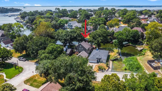 an aerial view of residential house with outdoor space and swimming pool