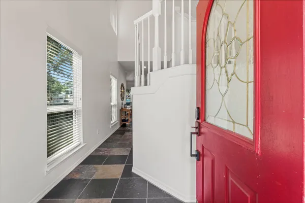a view of entryway with stairs and a window