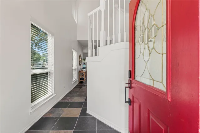 a view of entryway with stairs and a window