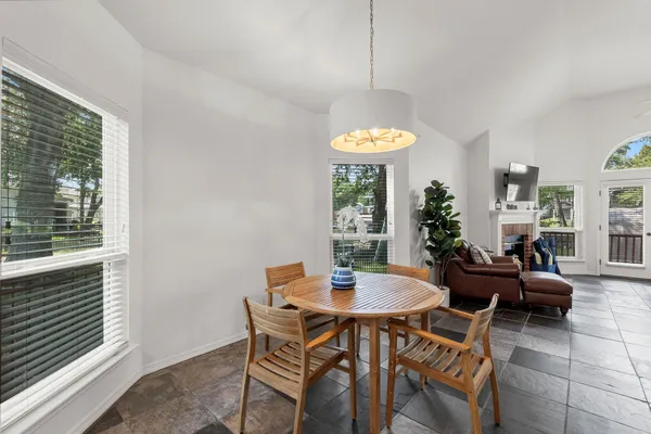 a view of a dining room with furniture window and outside view