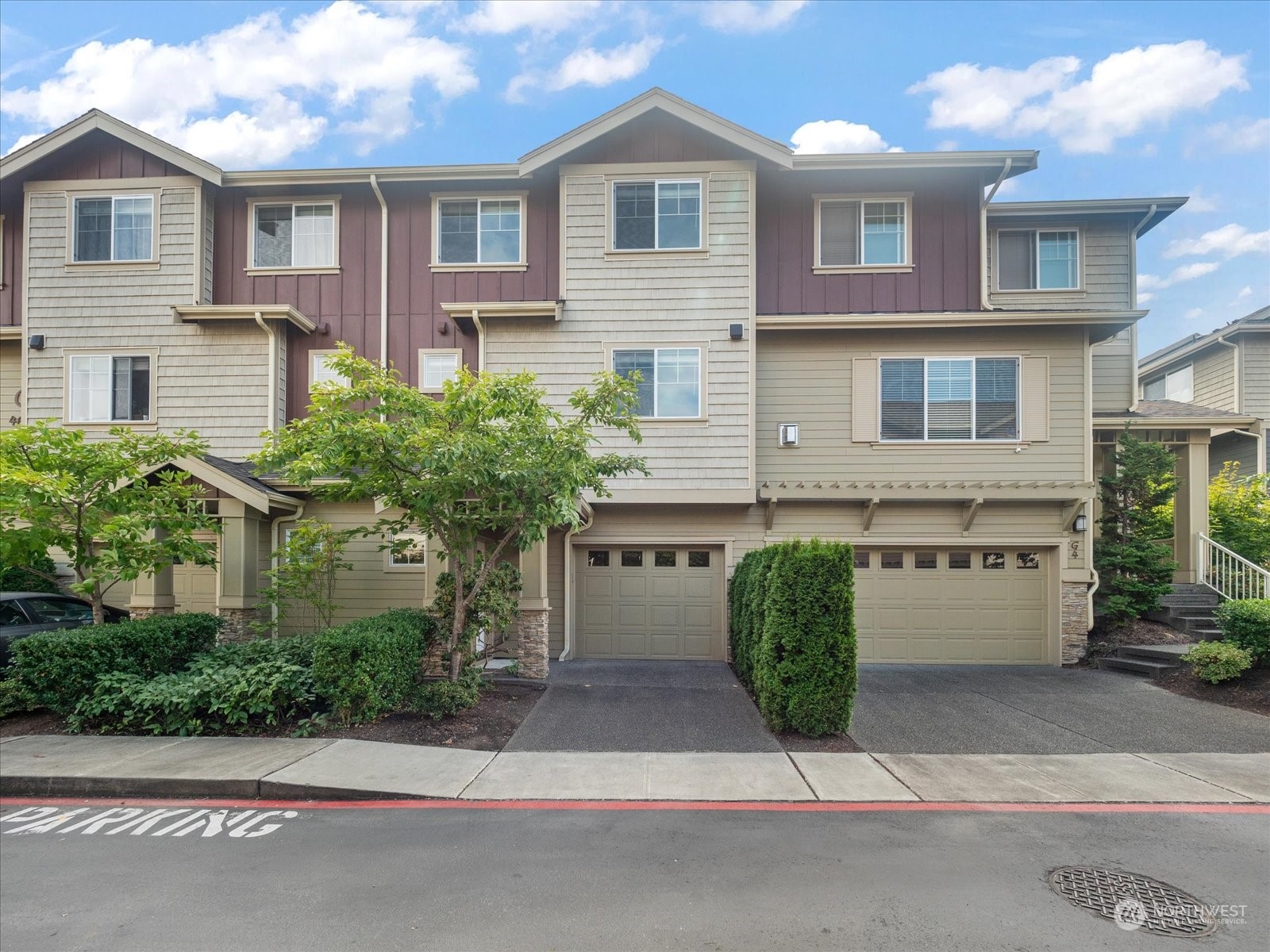 4625 Northeast 3rd Lane, Unit G3 Renton, WA 98059 - Photo 1 of 40 a front view of a house with garage