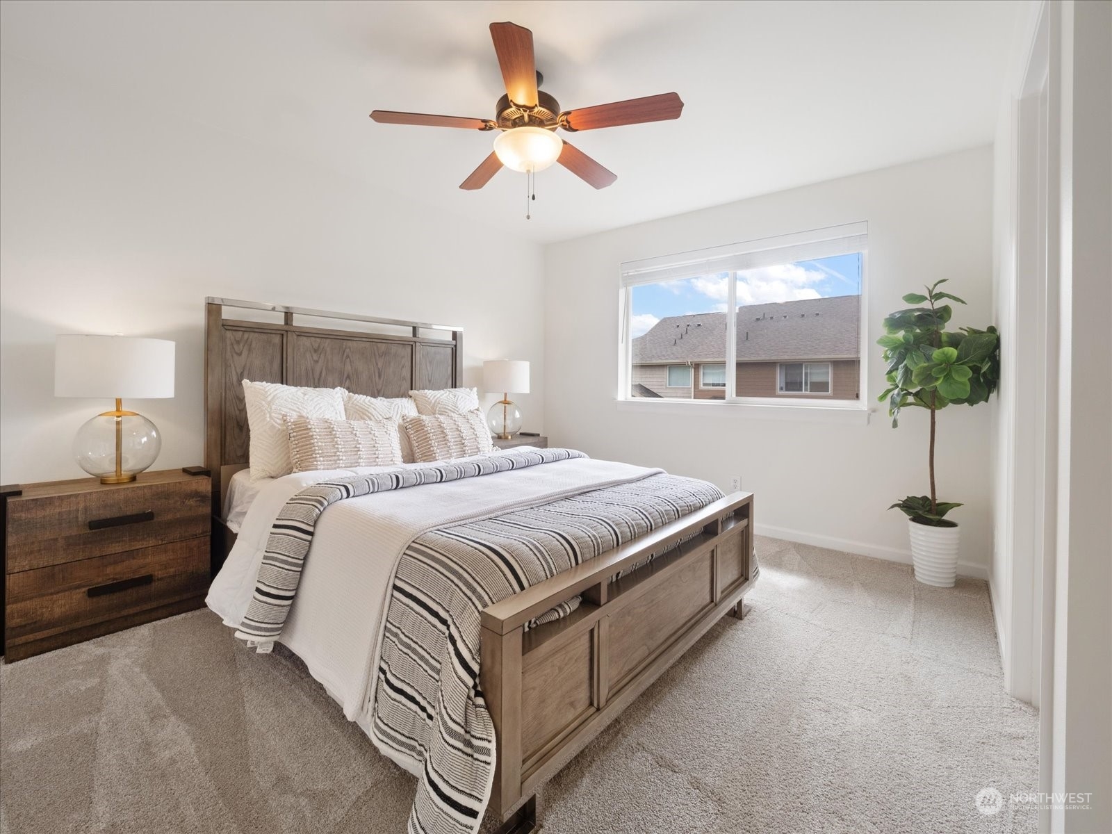 4625 Northeast 3rd Lane, Unit G3 Renton, WA 98059 - Photo 17 of 40 a spacious bedroom with a bed and a large window