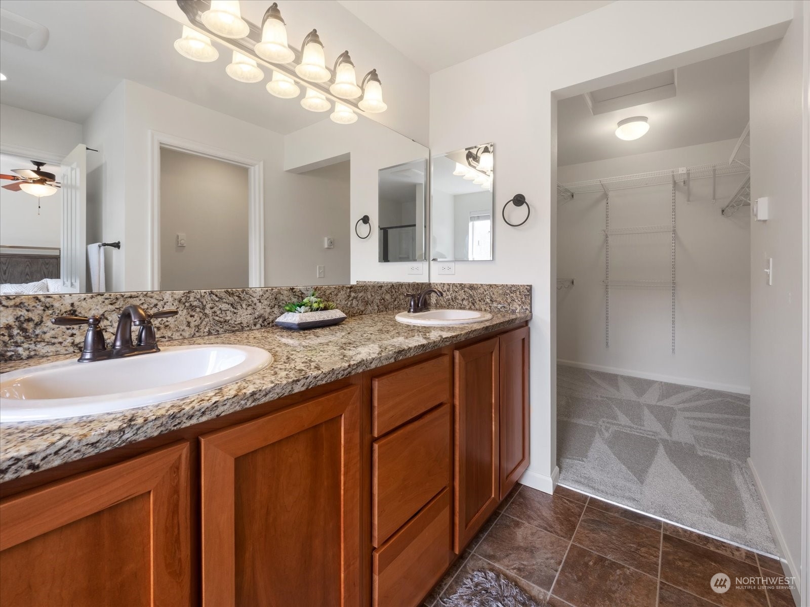 4625 Northeast 3rd Lane, Unit G3 Renton, WA 98059 - Photo 18 of 40 a bathroom with a granite countertop sink a large mirror and a shower