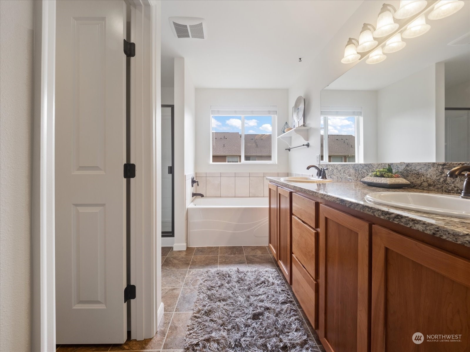 4625 Northeast 3rd Lane, Unit G3 Renton, WA 98059 - Photo 19 of 40 a bathroom with double vanity and a mirror