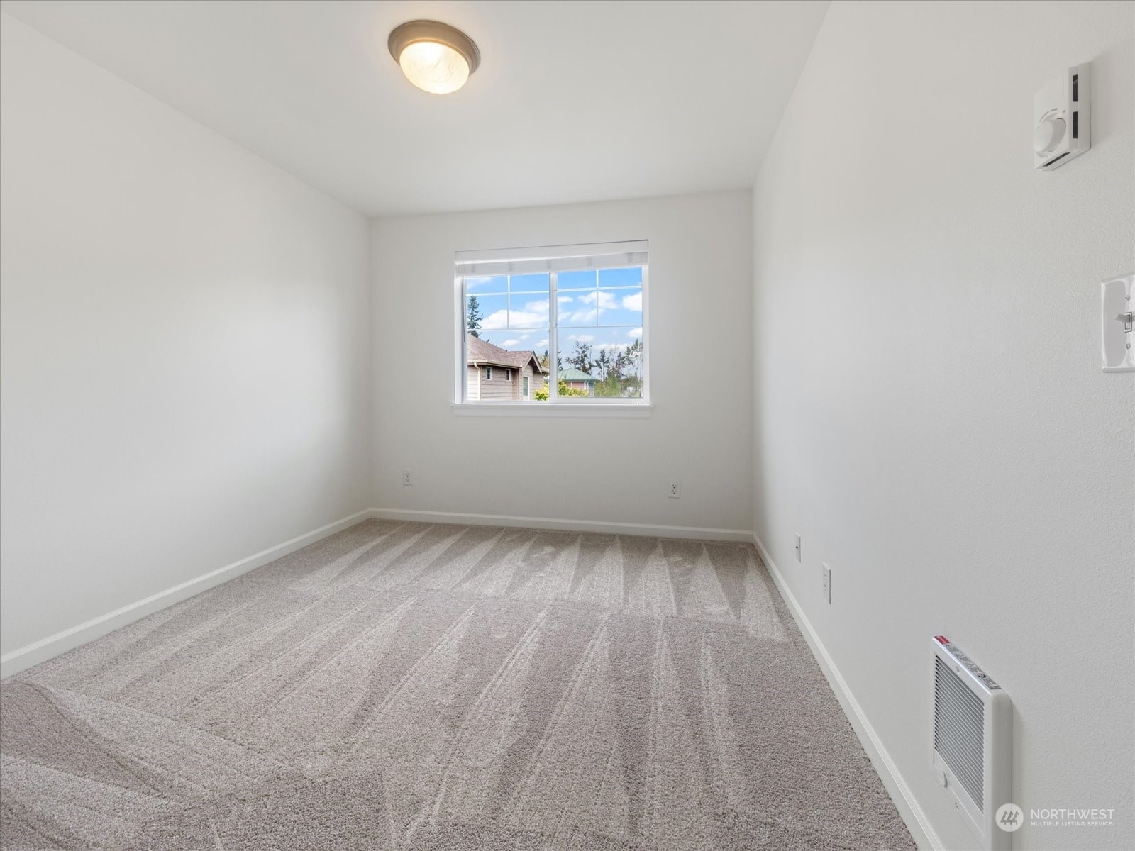 4625 Northeast 3rd Lane, Unit G3 Renton, WA 98059 - Photo 21 of 40 an empty room with a window