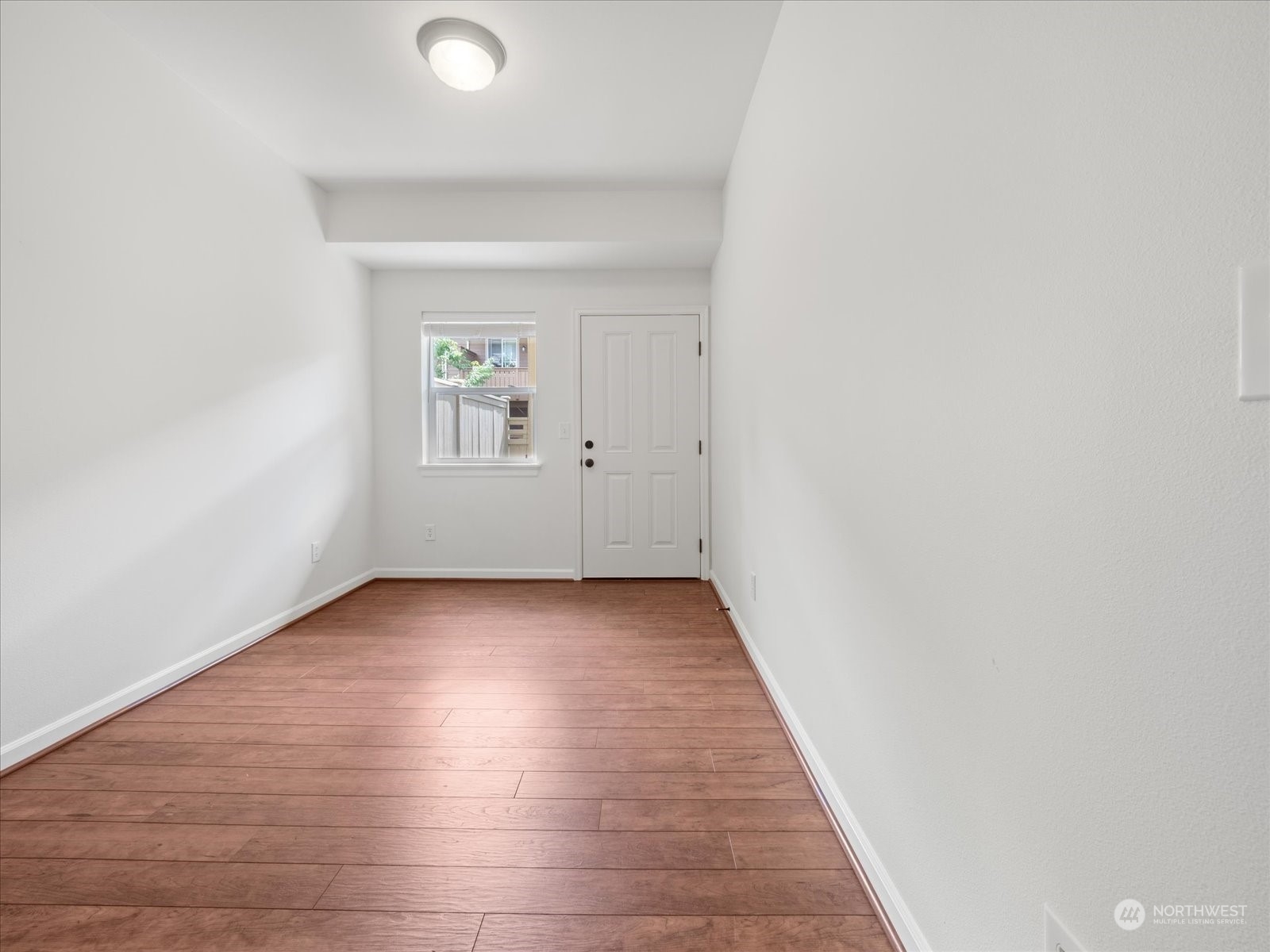4625 Northeast 3rd Lane, Unit G3 Renton, WA 98059 - Photo 26 of 40 an empty room with wooden floor and windows