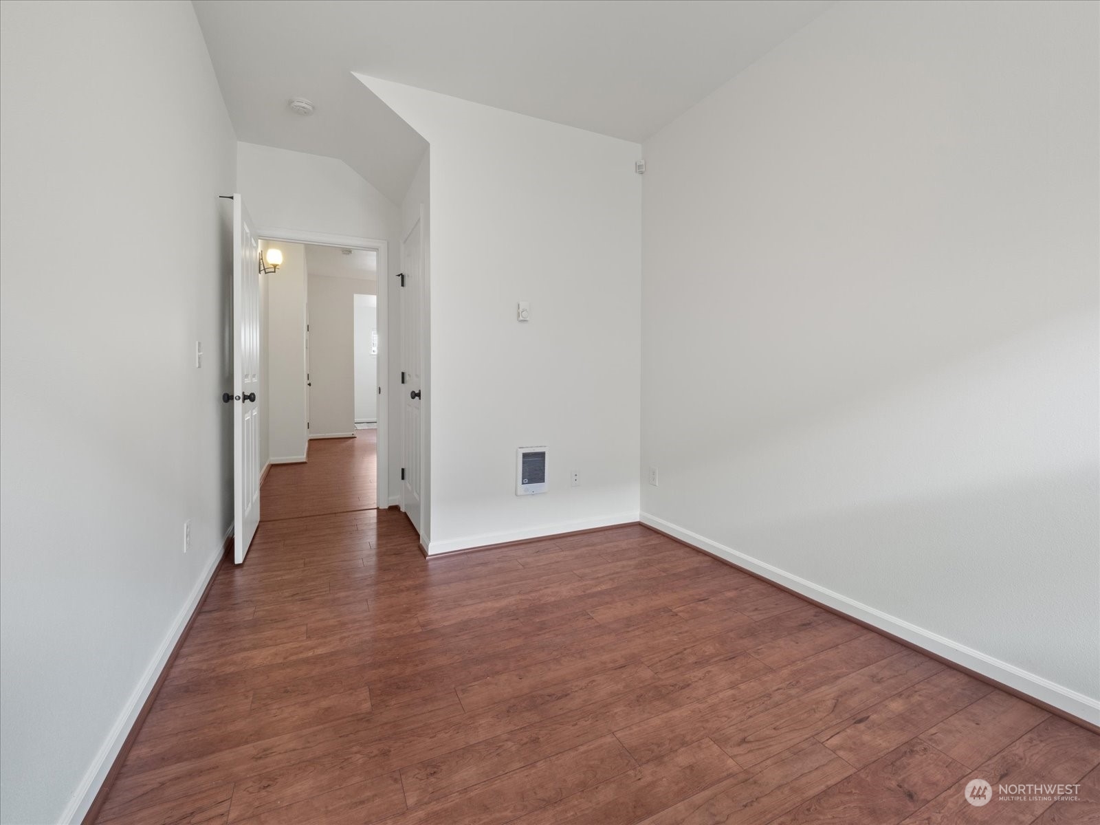 4625 Northeast 3rd Lane, Unit G3 Renton, WA 98059 - Photo 27 of 40 a view of an empty room with wooden floor and a window