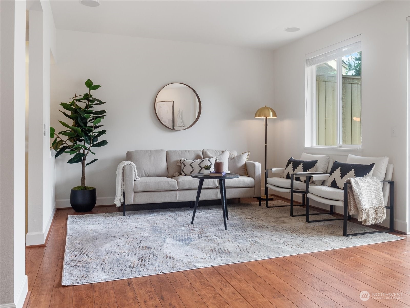 4625 Northeast 3rd Lane, Unit G3 Renton, WA 98059 - Photo 5 of 40 a living room with furniture potted plant and a large window