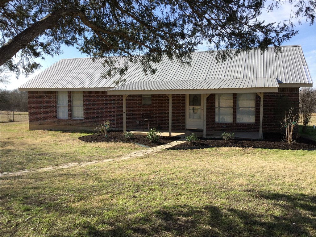 134 Dodd Preston Elgin, TX 78621 - Photo 1 of 1 a front view of a house with a yard