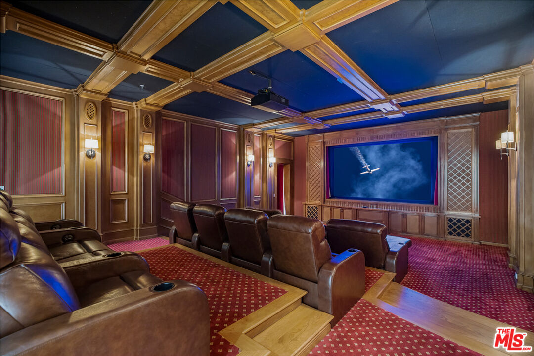 1940 Bel Air Road Los Angeles, CA 90077 - Photo 20 of 25 a living room with furniture and a flat screen tv