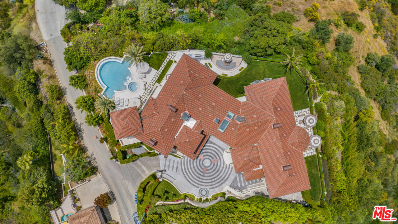 1940 Bel Air Road Los Angeles, CA 90077 - Photo 23 of 25 an aerial view of a house with garden space and swimming pool