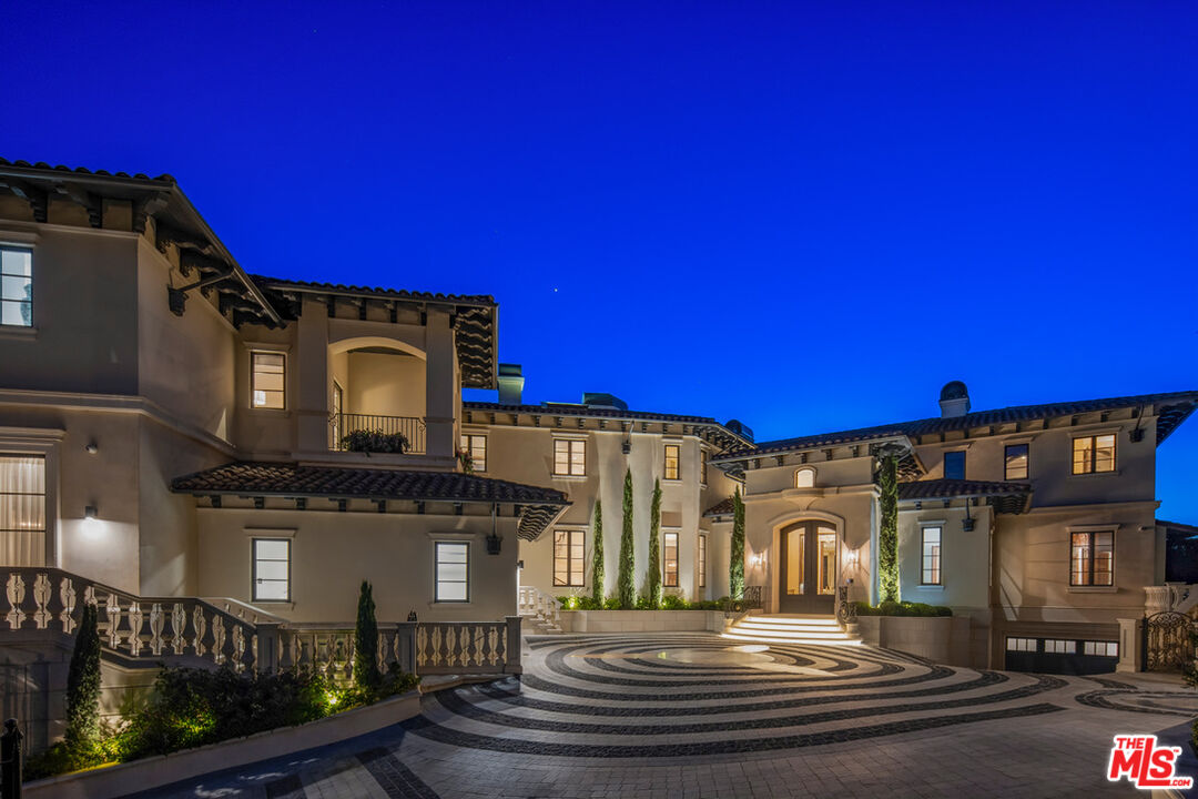 1940 Bel Air Road Los Angeles, CA 90077 - Photo 24 of 25 a front view of a house with a yard