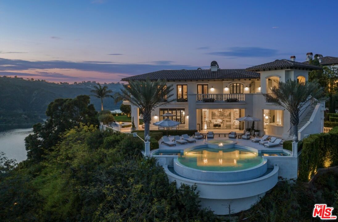 1940 Bel Air Road Los Angeles, CA 90077 - Photo 25 of 25 a view of a house with swimming pool and a yard