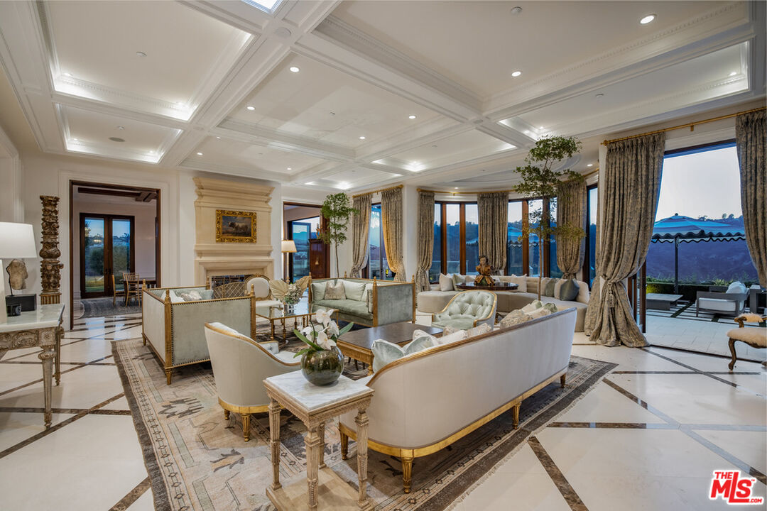 1940 Bel Air Road Los Angeles, CA 90077 - Photo 7 of 25 a living room with furniture a large window and rug