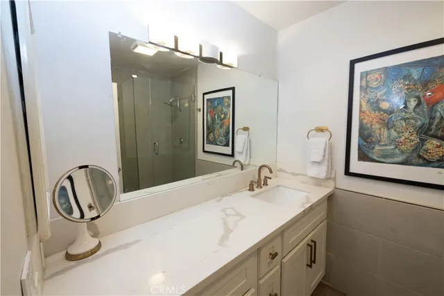 a bathroom with a sink and mirror