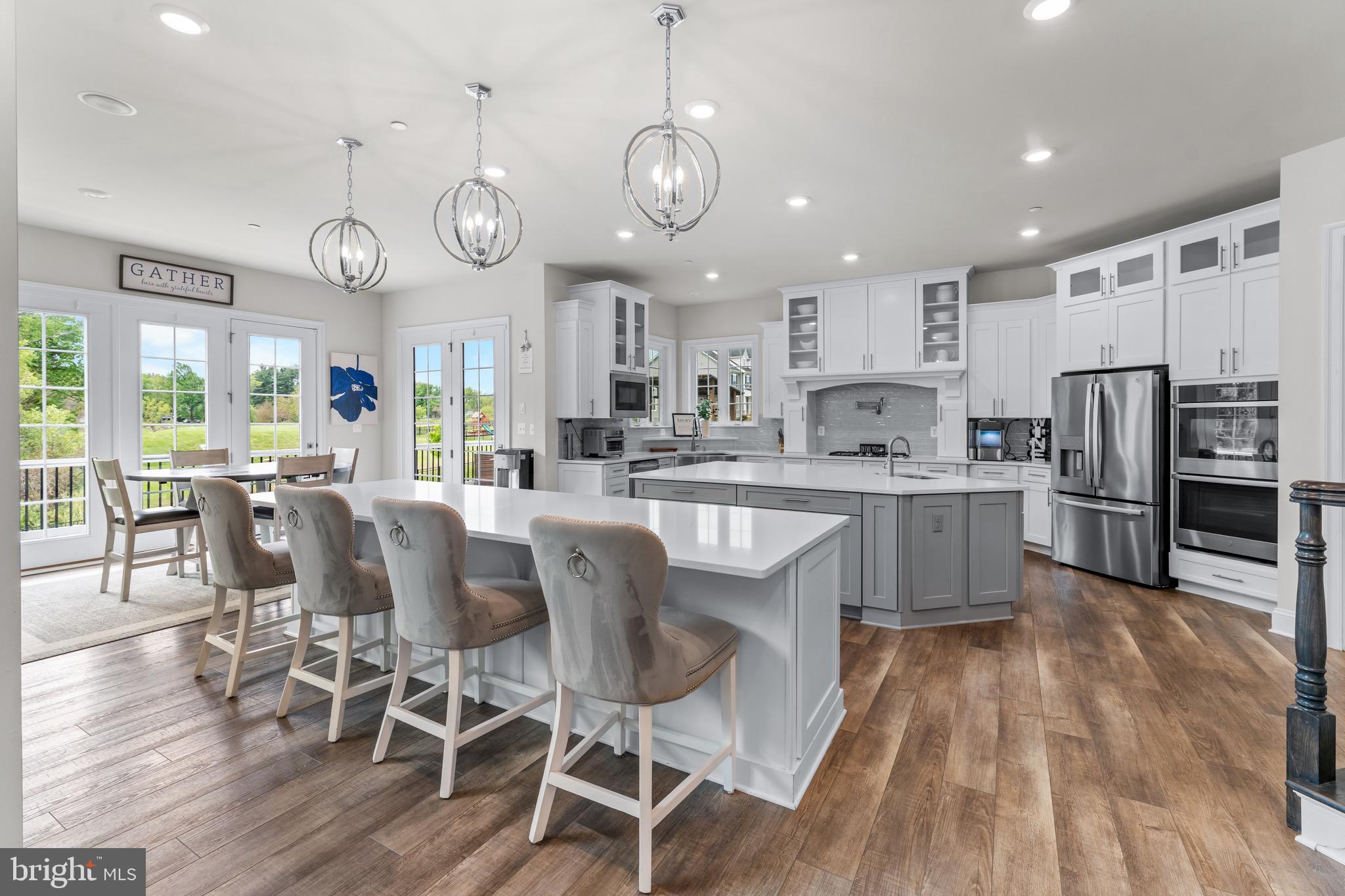 12201 Mayapple Trail Sykesville, MD 21784 - Photo 12 of 75 a large kitchen with a table and chairs