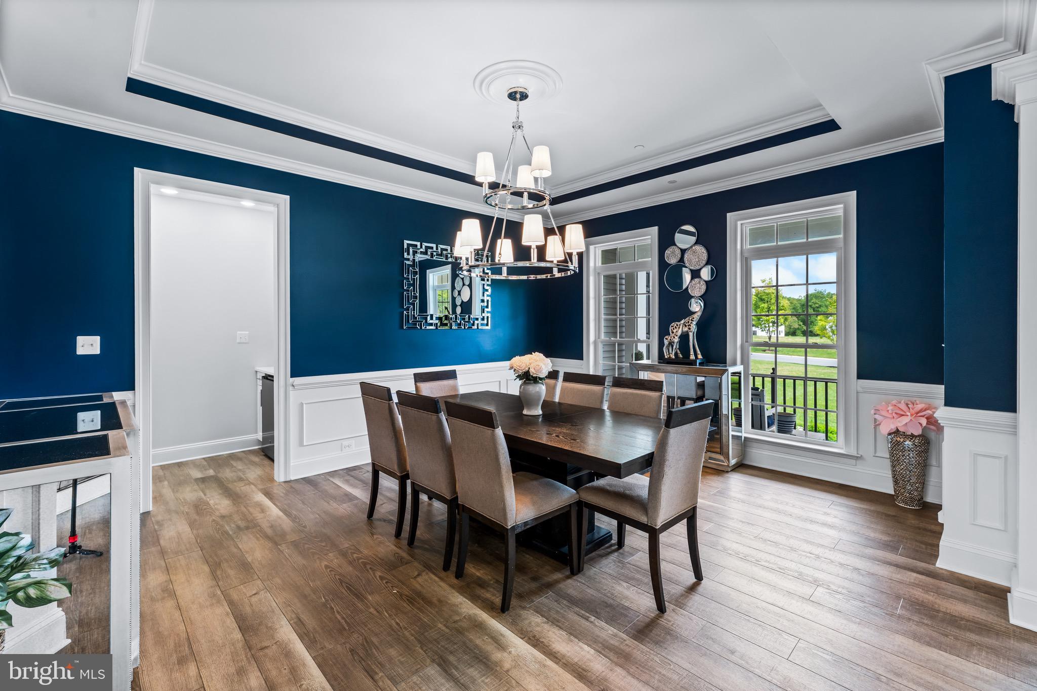 12201 Mayapple Trail Sykesville, MD 21784 - Photo 26 of 75 a view of a dining room with furniture window and wooden floor