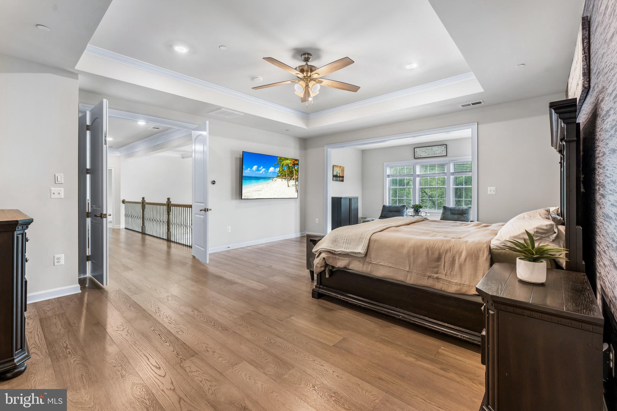 12201 Mayapple Trail Sykesville, MD 21784 - Photo 36 of 75 a bed room with a bed and a chandelier