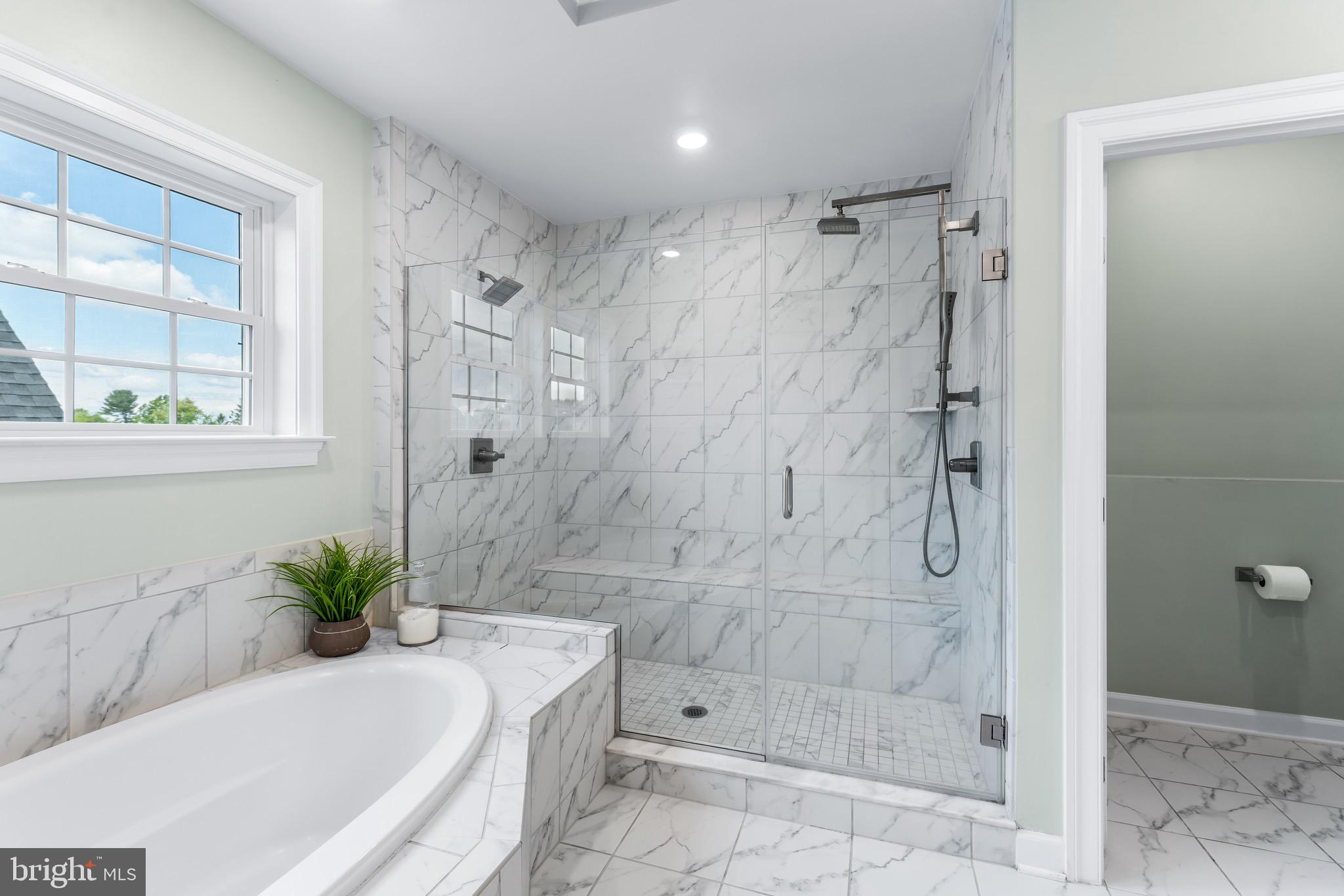 12201 Mayapple Trail Sykesville, MD 21784 - Photo 41 of 75 a white bath tub sitting next to a shower