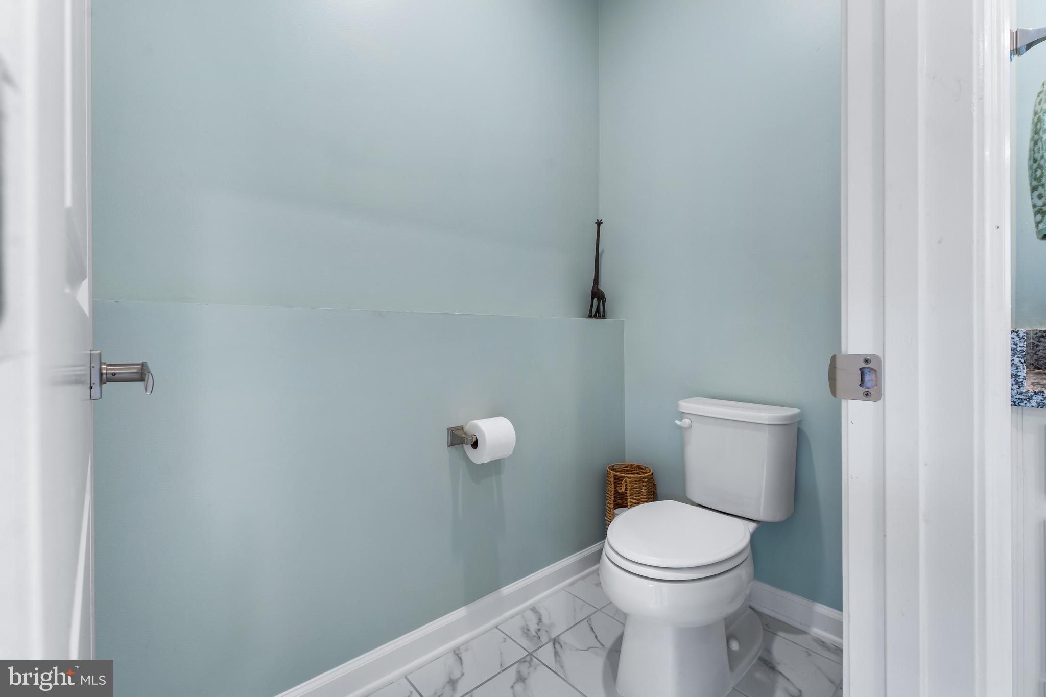 12201 Mayapple Trail Sykesville, MD 21784 - Photo 42 of 75 a white toilet sitting next to a white sink