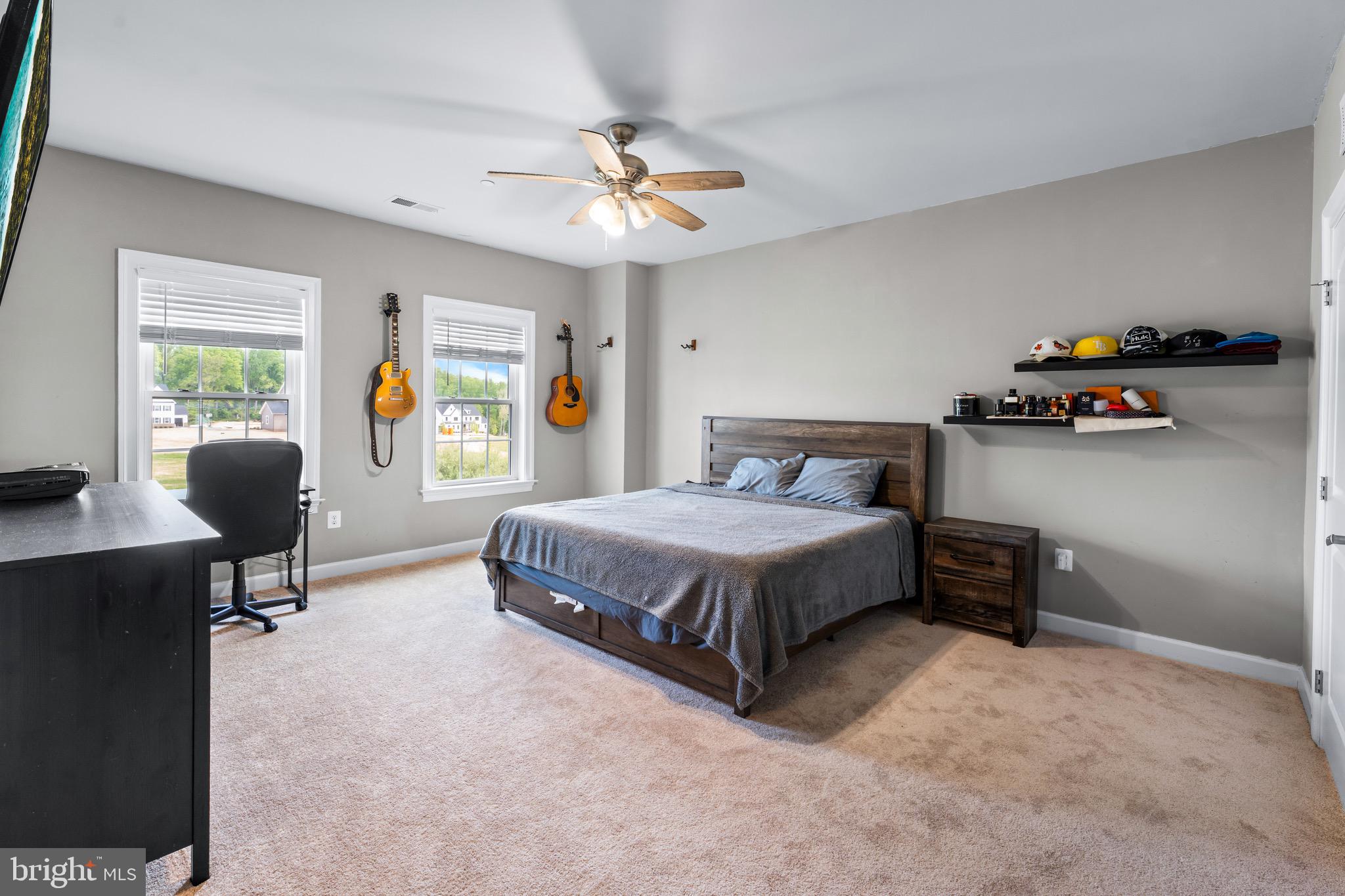 12201 Mayapple Trail Sykesville, MD 21784 - Photo 43 of 75 a bedroom with a bed gym equipment and a desk