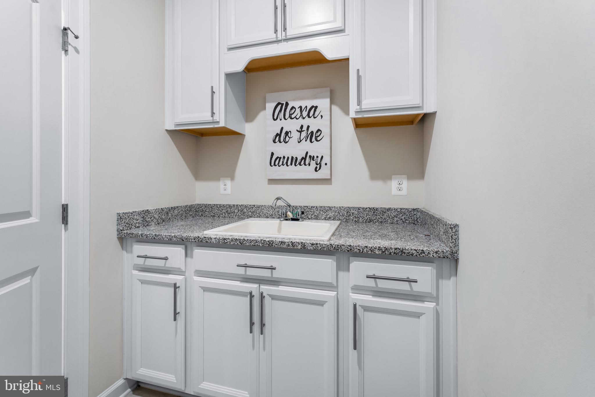 12201 Mayapple Trail Sykesville, MD 21784 - Photo 51 of 75 a bathroom with a granite countertop sink and a stove