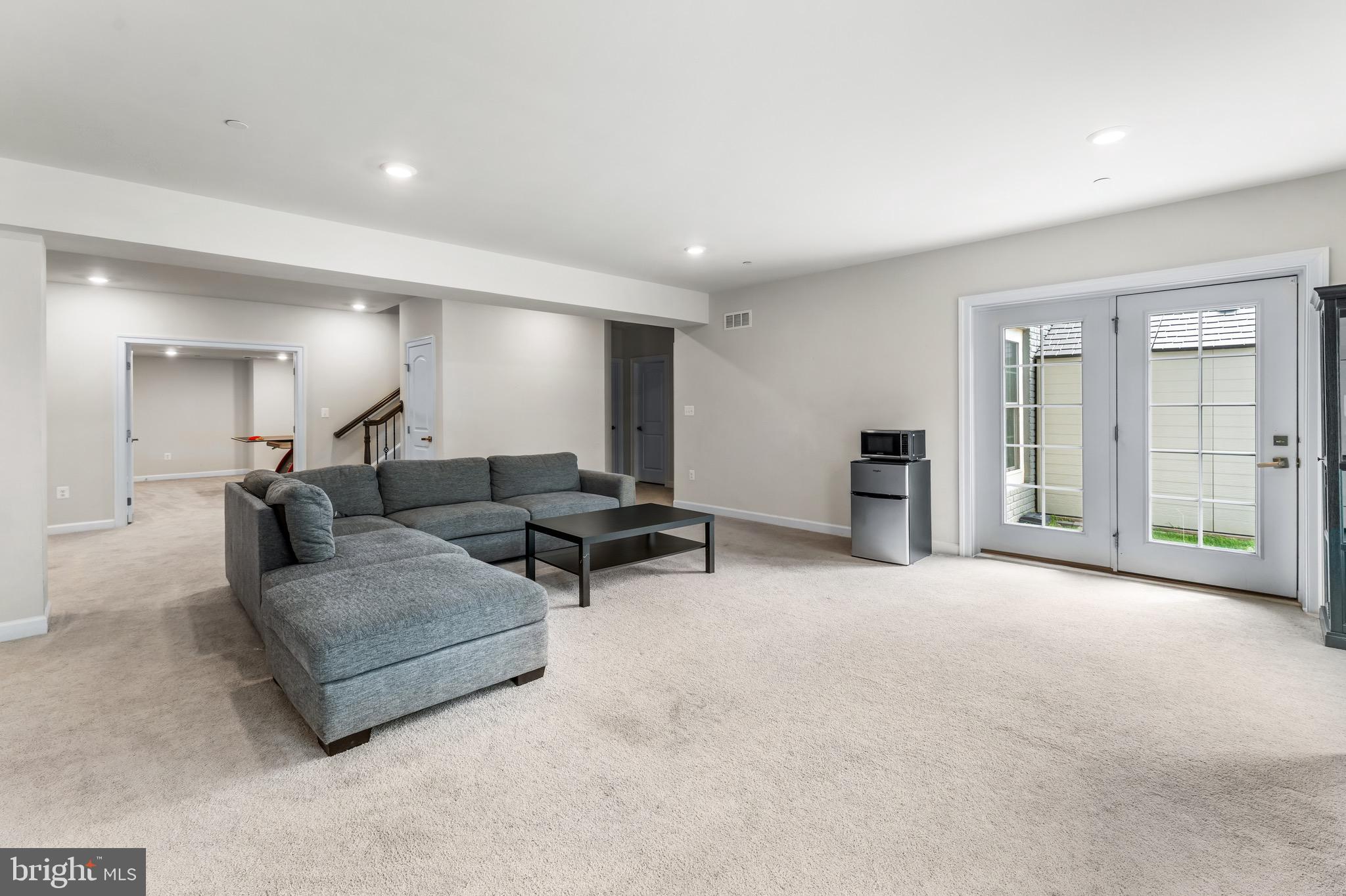 12201 Mayapple Trail Sykesville, MD 21784 - Photo 56 of 75 a living room with furniture and a flat screen tv