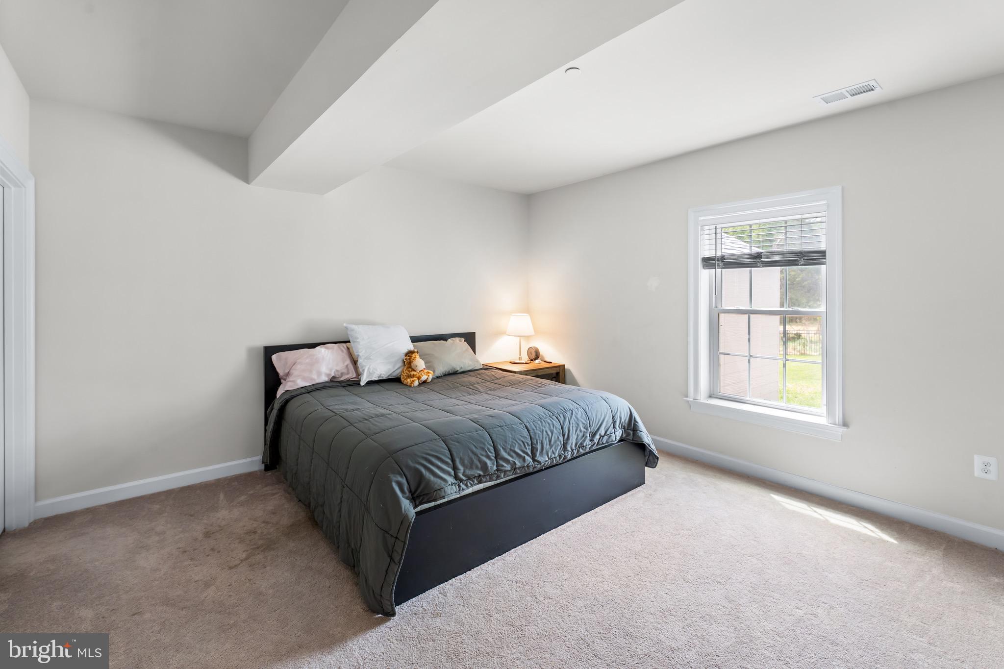 12201 Mayapple Trail Sykesville, MD 21784 - Photo 60 of 75 a bedroom with a bed and window