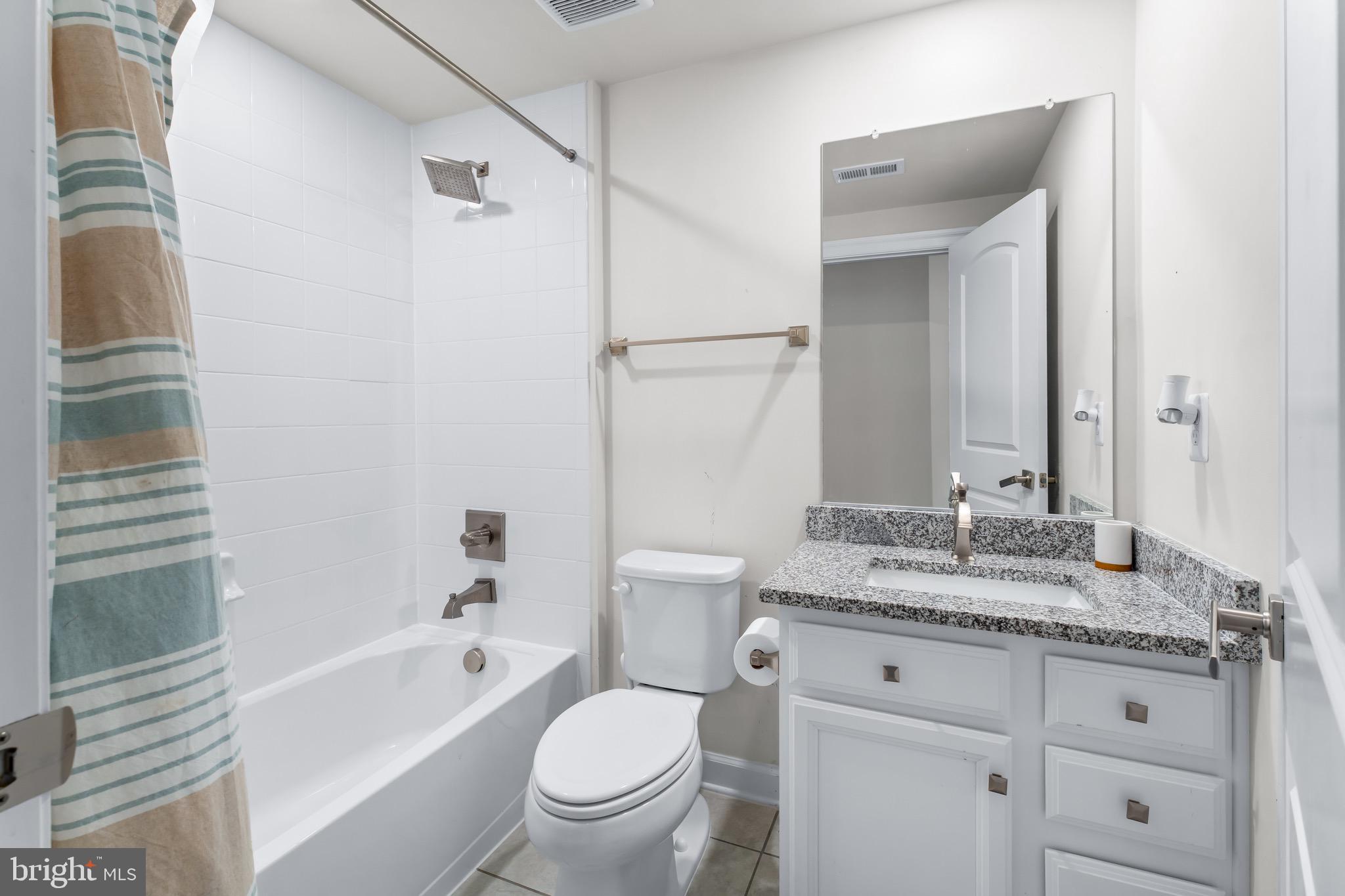 12201 Mayapple Trail Sykesville, MD 21784 - Photo 61 of 75 a bathroom with a granite countertop sink toilet tub and shower