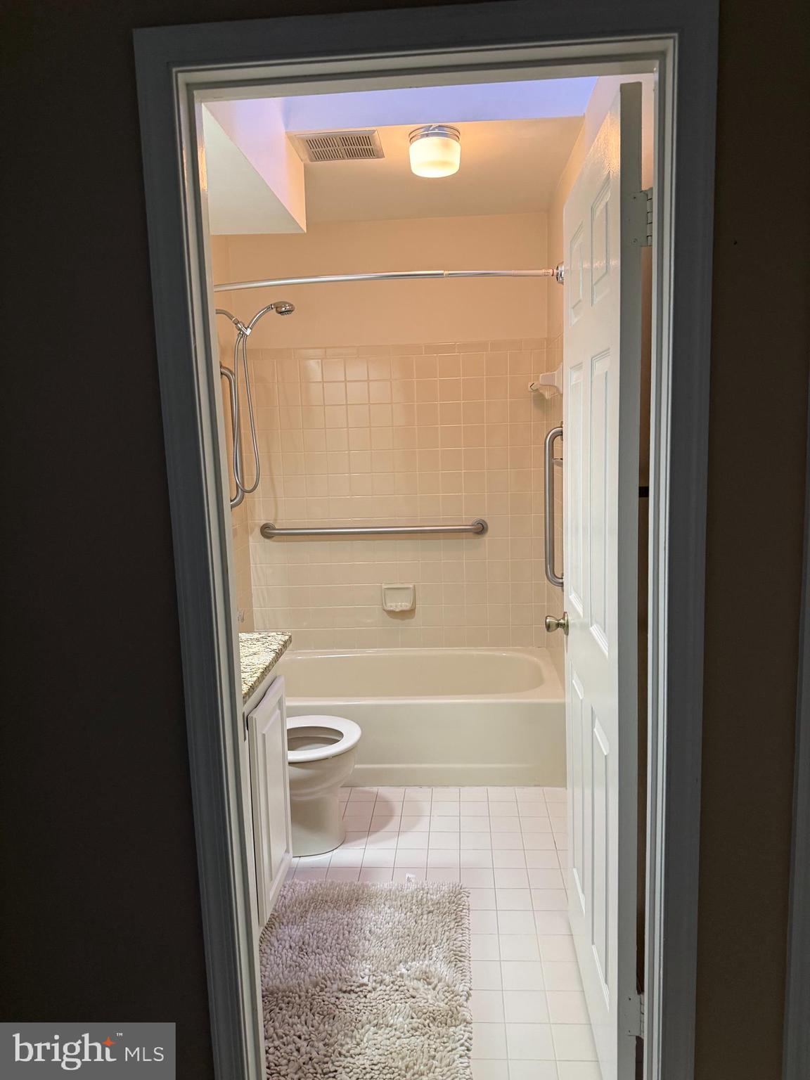 3869 Appaloosa Drive Woodbridge, VA 22192 - Photo 13 of 16 a bathroom with a bathtub and a shower
