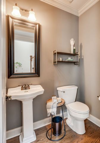 a living room with lots of furniture and a chandelier