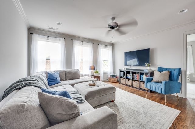 a spacious bedroom with a bed and a window