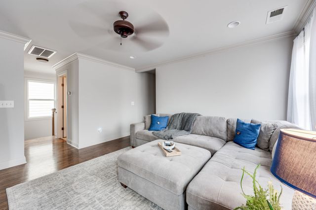 a bedroom with a bed and a desk