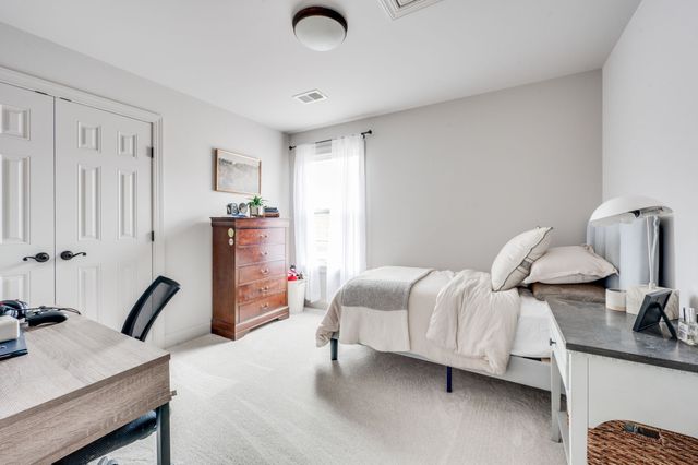 a view of a patio with couches table and chairs and potted plants