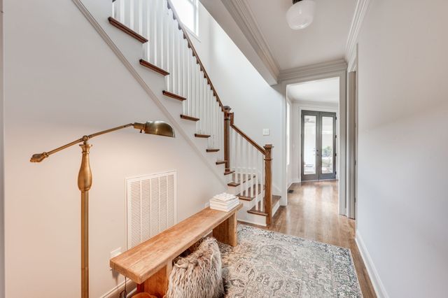 a view of a hallway view with staircase