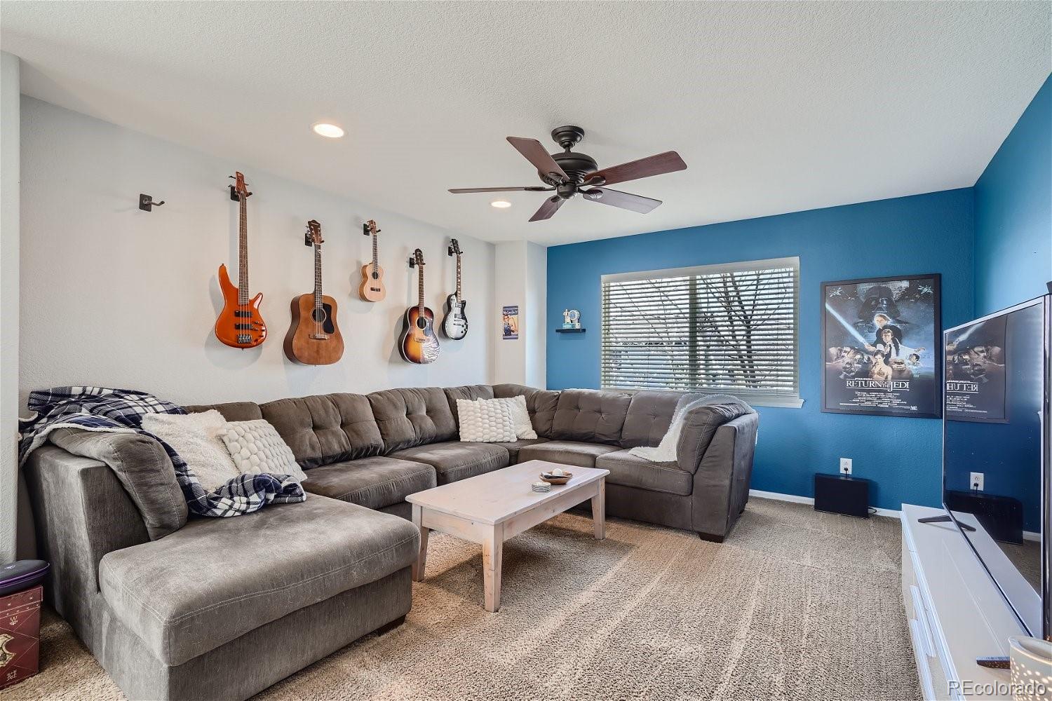 3085 Meadowbrook Place Dacono, CO 80514 - Photo 18 of 32 a living room with furniture