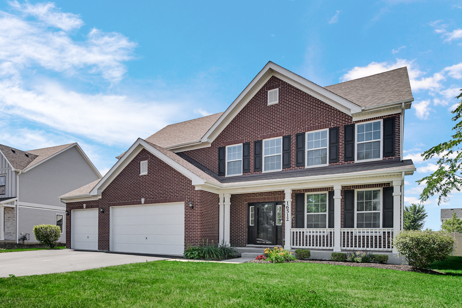 front view of a house with a yard