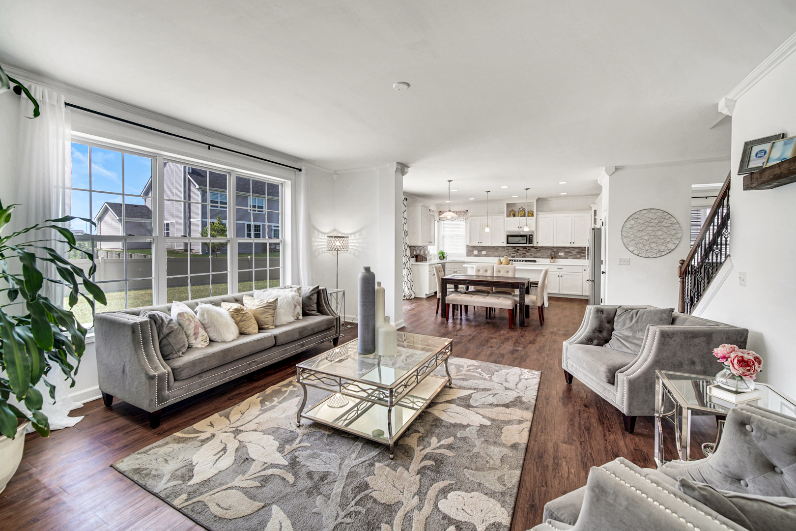 16512 Mueller Circle Plainfield, IL 60586 - Photo 11 of 29 a living room with furniture fireplace and a large window