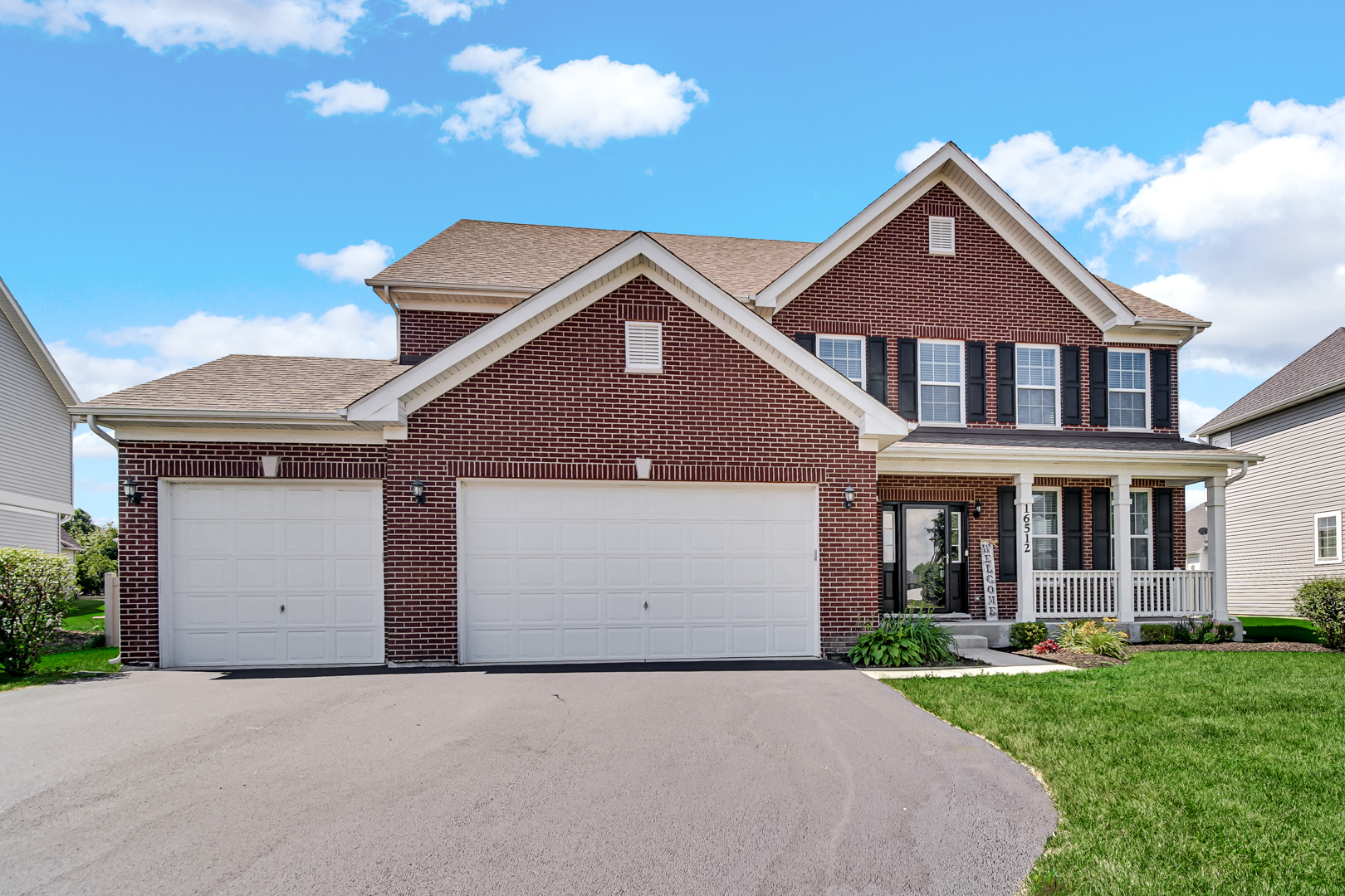 16512 Mueller Circle Plainfield, IL 60586 - Photo 2 of 29 front view of house with a yard