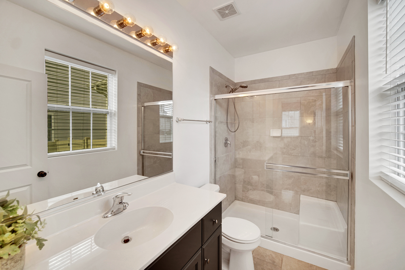 16512 Mueller Circle Plainfield, IL 60586 - Photo 26 of 29 a bathroom with a sink mirror toilet and bathtub