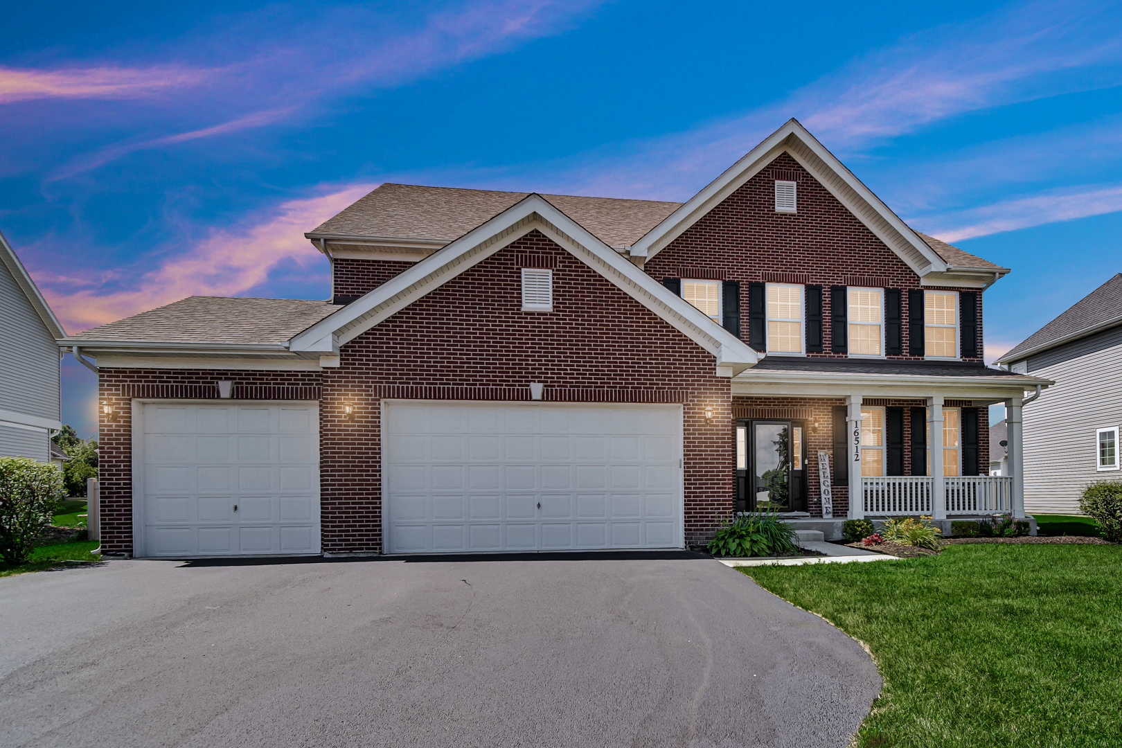 16512 Mueller Circle Plainfield, IL 60586 - Photo 3 of 29 front view of a house with a yard