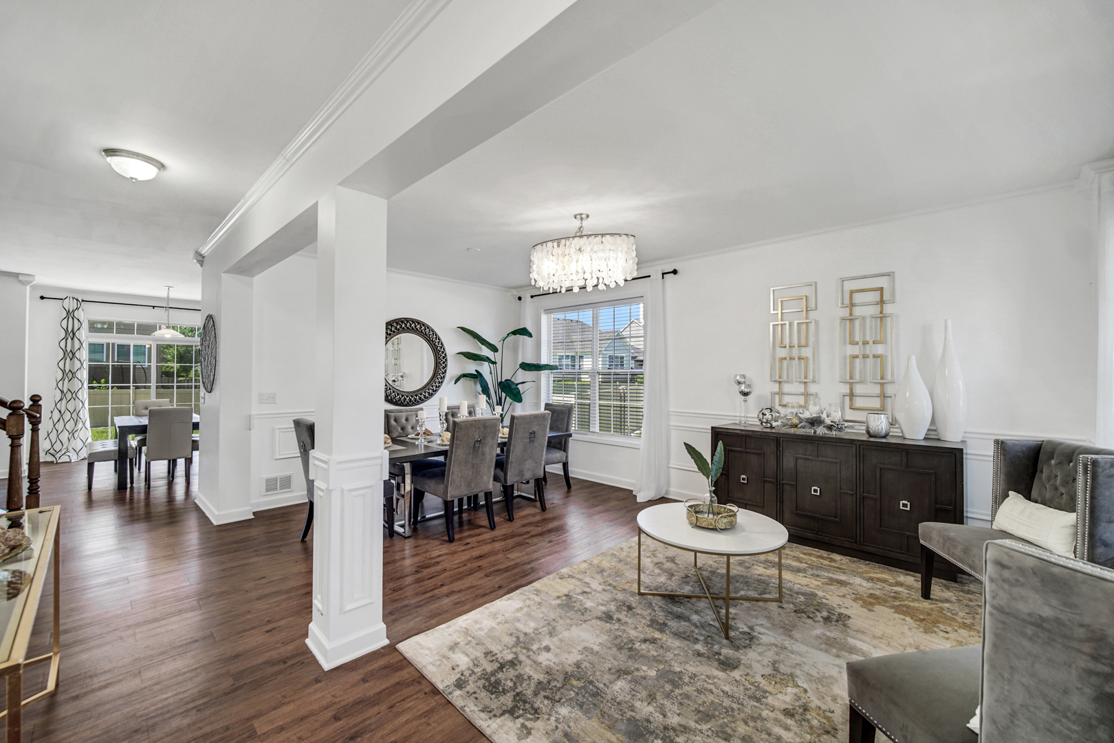 16512 Mueller Circle Plainfield, IL 60586 - Photo 4 of 29 a living room with furniture a dining table and a large window