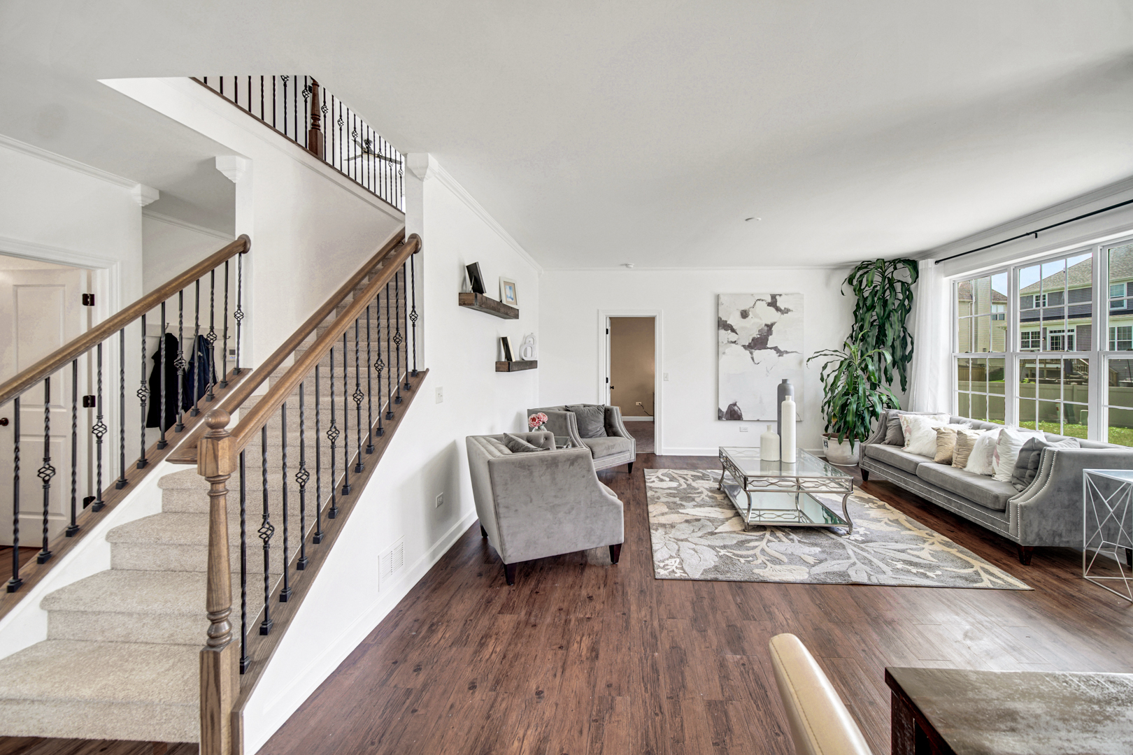 16512 Mueller Circle Plainfield, IL 60586 - Photo 10 of 29 a living room with furniture and wooden floor