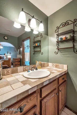 a bathroom with a sink and a mirror