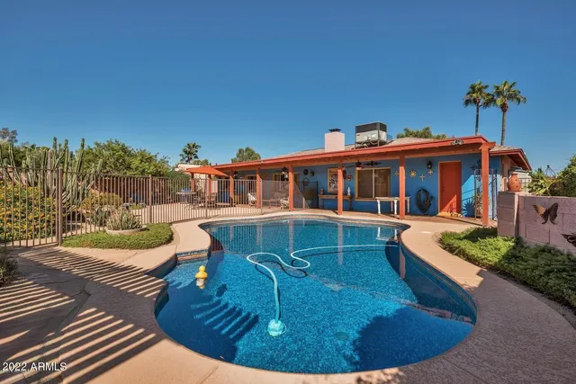 a view of a house with roof deck and sitting area
